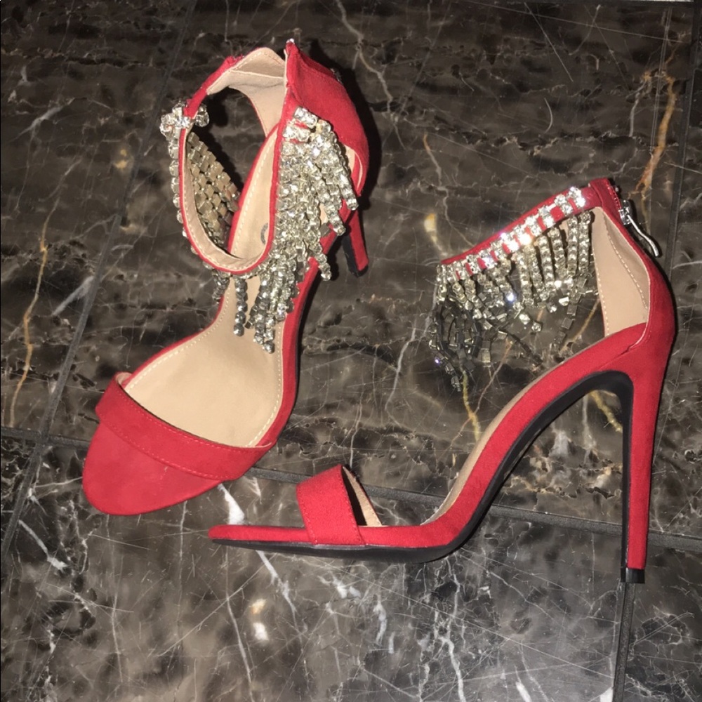 Red high heels with dangling faux diamonds